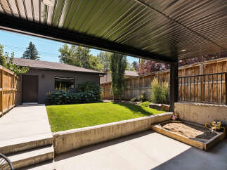 Enjoy outdoor living in this spacious backyard featuring a covered patio perfect for entertaining.