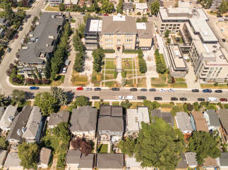 Discover modern urban living in this vibrant neighborhood, featuring a mix of contemporary apartment buildings and charming single-family homes.