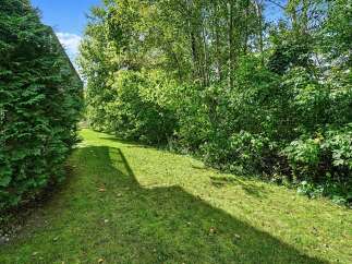 Enjoy the lush greenery and natural beauty surrounding this property.