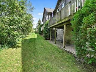Enjoy the lush greenery and private backyard of this property, perfect for outdoor relaxation and entertaining.