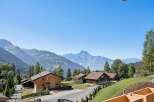 Experience serene mountain living in this charming wooden chalet nestled amidst breathtaking alpine scenery.