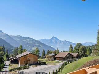 Experience serene mountain living in this charming wooden chalet nestled amidst breathtaking alpine scenery.