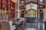 Experience luxurious mountain living in this stunning dining room, featuring a grand live-edge dining table perfect for hosting.
