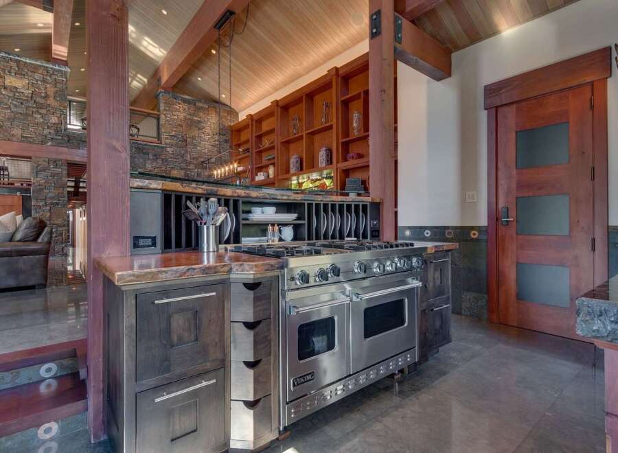 Experience luxury mountain living in this stunning kitchen, featuring a professional-grade Viking range and custom wood cabinetry.