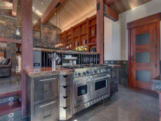 Experience luxury mountain living in this stunning kitchen, featuring a professional-grade Viking range and custom wood cabinetry.