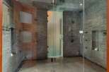 Experience ultimate relaxation in this luxurious spa-like shower featuring multiple shower heads and a sleek glass enclosure.