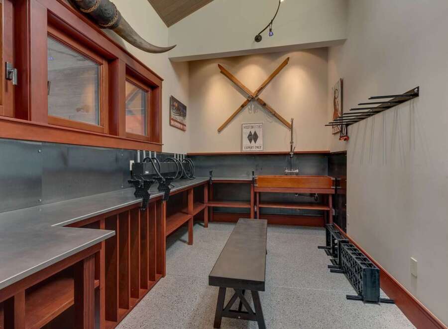 This unique space offers a dedicated workshop area, perfect for tuning skis or pursuing other hobbies.