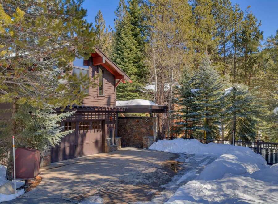 Nestled amidst towering pines, this charming mountain home offers a serene retreat.