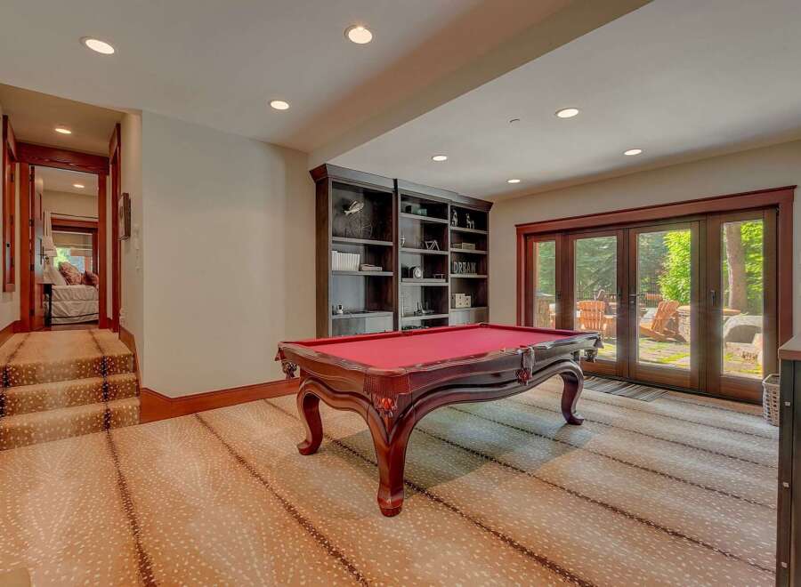 This basement recreation room offers a perfect blend of entertainment and relaxation.