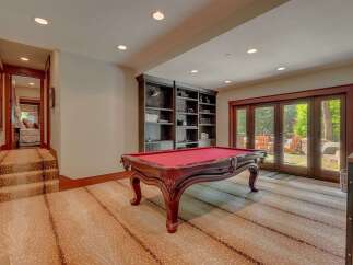 This basement recreation room offers a perfect blend of entertainment and relaxation.