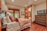 This charming bedroom features a comfortable bed adorned with plush pillows and a decorative duvet, creating a cozy retreat.