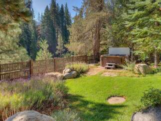 Enjoy ultimate relaxation in this backyard oasis, featuring a luxurious hot tub perfect for unwinding after a long day.
