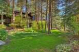 Nestled amongst mature trees, this stunning property offers a serene retreat with a beautifully manicured lawn perfect for outdoor enjoyment.
