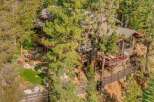 Nestled amongst towering pine trees, this stunning mountain home offers a serene escape.