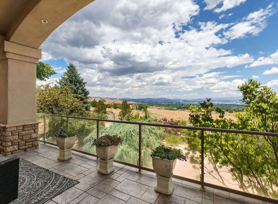 Enjoy breathtaking panoramic views from this stunning property's expansive balcony, perfect for entertaining or quiet relaxation.