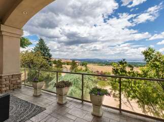 Enjoy breathtaking panoramic views from this stunning property's expansive balcony, perfect for entertaining or quiet relaxation.