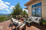 Enjoy breathtaking panoramic views from this expansive outdoor living space, perfect for entertaining or quiet relaxation.