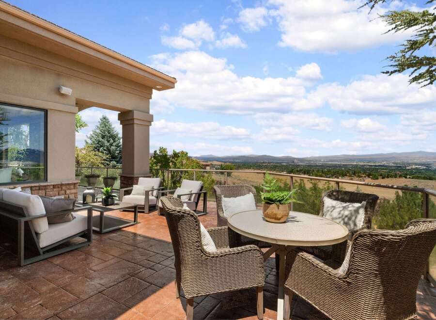 Enjoy breathtaking panoramic views from this expansive patio, perfect for entertaining or quiet relaxation.