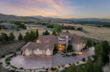 Experience luxury living in this stunning custom-built estate, nestled on a hillside with panoramic views of the valley and distant mountains.