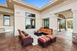 Enjoy outdoor living in this spacious patio area, perfect for entertaining guests or relaxing with family.