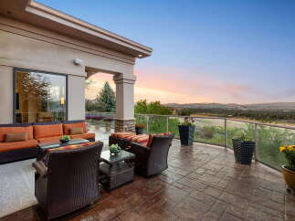 Enjoy breathtaking sunset views from this expansive patio, perfect for entertaining or quiet relaxation.
