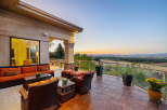 Experience breathtaking sunset views from this expansive patio, perfect for entertaining or quiet relaxation.