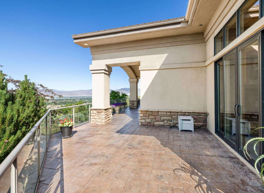 Enjoy breathtaking panoramic views from this expansive balcony, perfect for entertaining or quiet relaxation.