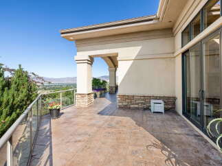 Enjoy breathtaking panoramic views from this expansive balcony, perfect for entertaining or quiet relaxation.