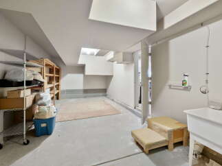 This versatile space offers ample storage with metal and wooden shelving units, perfect for organizing your belongings.