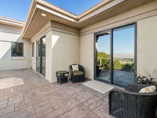 Enjoy breathtaking panoramic views from this expansive patio, perfect for entertaining or quiet relaxation.