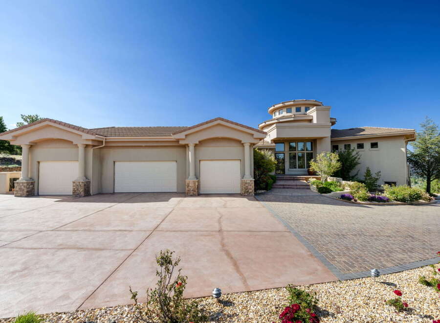 Discover this stunning custom-built home featuring a unique circular tower entrance and a spacious three-car garage.