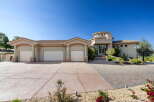 Discover this stunning custom-built home featuring a unique circular tower entrance and a spacious three-car garage.