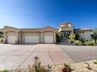 Discover this stunning custom-built home featuring a unique circular tower entrance and a spacious three-car garage.