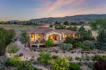 Experience luxury living in this stunning estate, featuring a grand circular rotunda and expansive wrap-around deck perfect for entertaining.