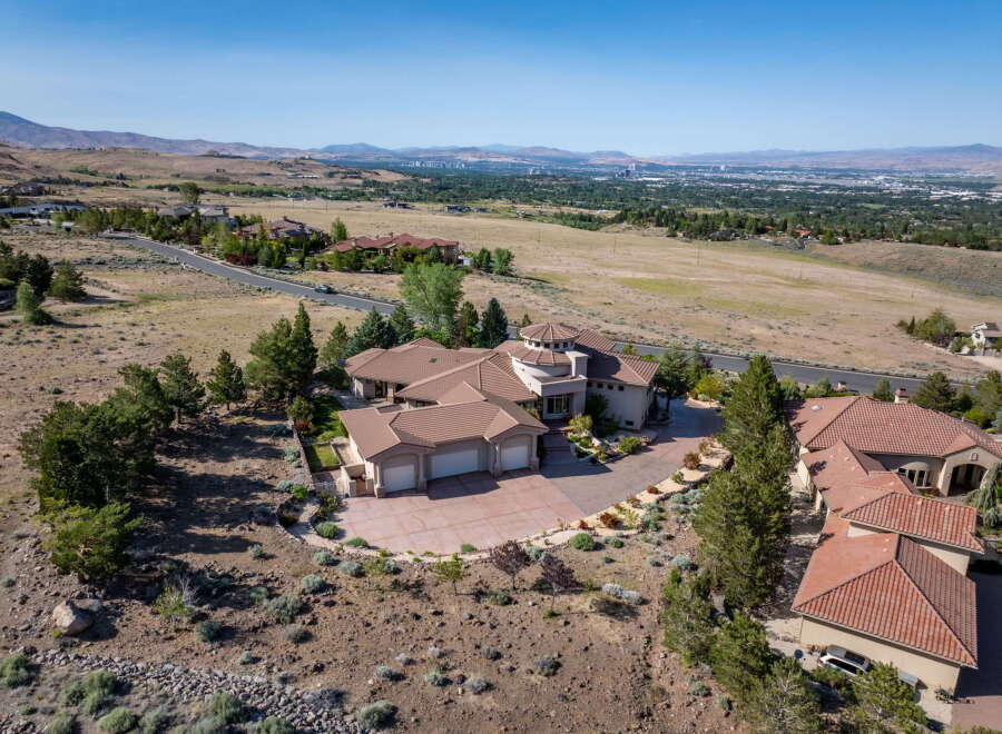 Experience luxury living in this stunning estate, boasting a unique circular turret and expansive living spaces.