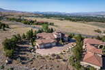 Experience luxury living in this stunning estate, boasting a unique circular turret and expansive living spaces.