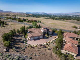 Experience luxury living in this stunning estate, boasting a unique circular turret and expansive living spaces.
