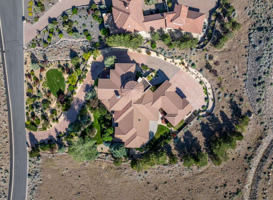 Experience luxury living in this stunning aerial view of a sprawling estate.
