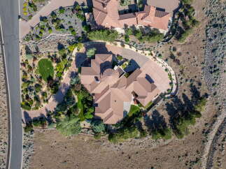 Experience luxury living in this stunning aerial view of a sprawling estate.