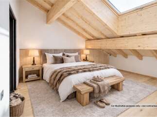 Experience ultimate comfort in this beautifully appointed bedroom, featuring a plush king-sized bed adorned with luxurious faux fur throws.
