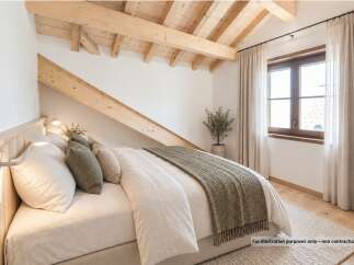 Experience cozy living in this charming bedroom featuring exposed wooden beams and a sloped ceiling, creating a rustic and inviting atmosphere.