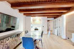 Experience modern living in this beautifully renovated space featuring exposed wooden beams and a sleek, contemporary design.
