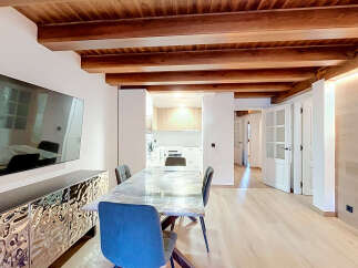 Experience modern living in this beautifully renovated space featuring exposed wooden beams and a sleek, contemporary design.