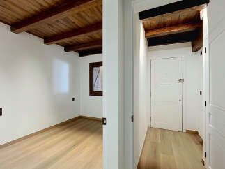 Experience rustic charm and modern comfort in this beautifully renovated space, featuring exposed wooden beams and a warm, inviting atmosphere.