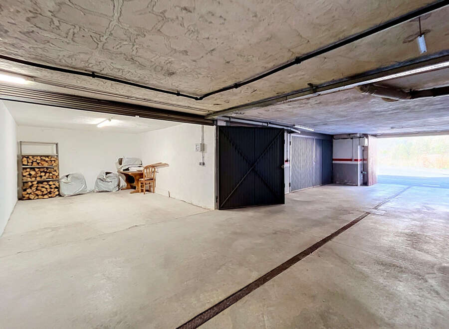 Discover this spacious garage with ample storage solutions, perfect for protecting your vehicles.