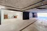 Discover this spacious garage with ample storage solutions, perfect for protecting your vehicles.