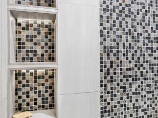 Experience modern luxury with this stunning bathroom featuring intricate mosaic tile work.