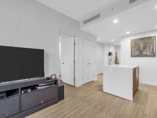 Experience modern living in this bright and airy open-concept space, featuring a sleek kitchen island perfect for entertaining.