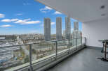 Experience breathtaking city and mountain views from this expansive balcony, perfect for entertaining or relaxing.