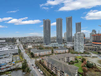 Experience modern urban living in this vibrant cityscape featuring sleek high-rise apartments and ongoing construction for future developments.